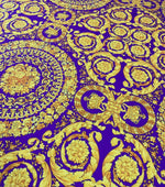 Purple Baroque Pattern Fabric with intricate gold floral and ornamental designs on a rich purple background, ideal for upholstery and drapery.