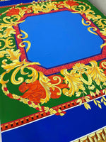 Baroque Silky Crepe Fabric with vibrant blue center and intricate gold and red baroque patterns on green background