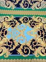 Baroque silky crepe fabric with intricate gold baroque patterns on blue, green, and black background