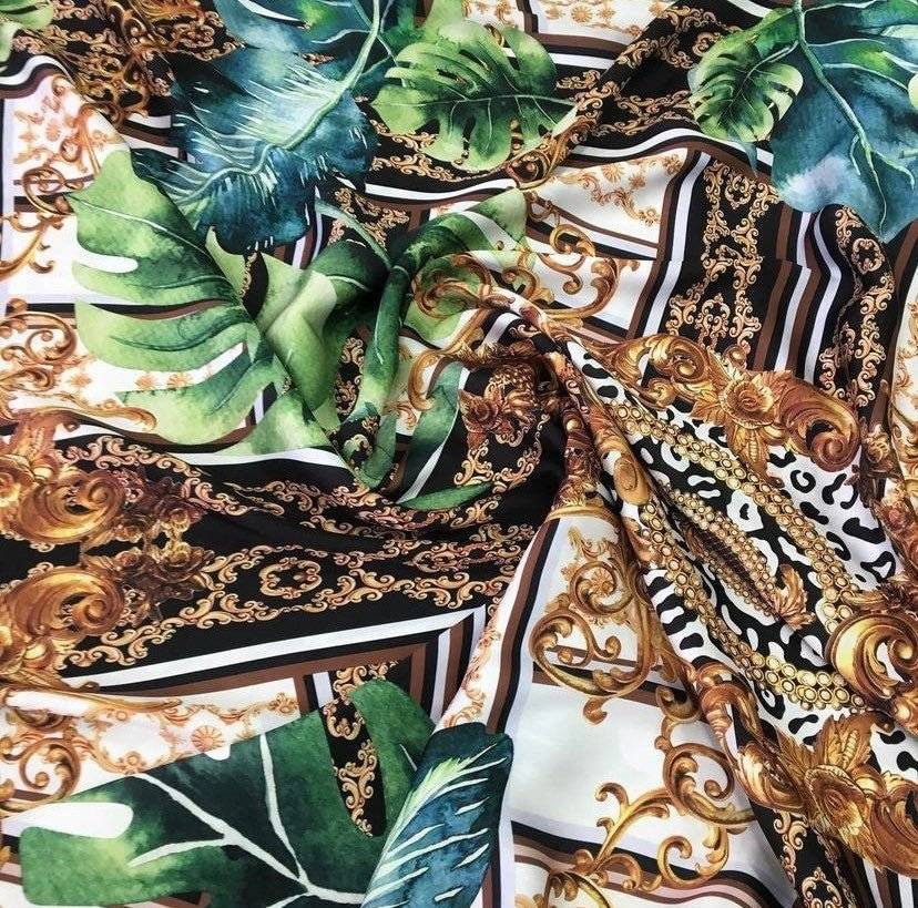 Baroque tropical green and gold fabric with ornate baroque design and tropical leaf patterns for upholstery