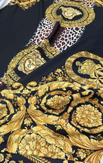 Black fabric with gold baroque patterns and leopard print accents design