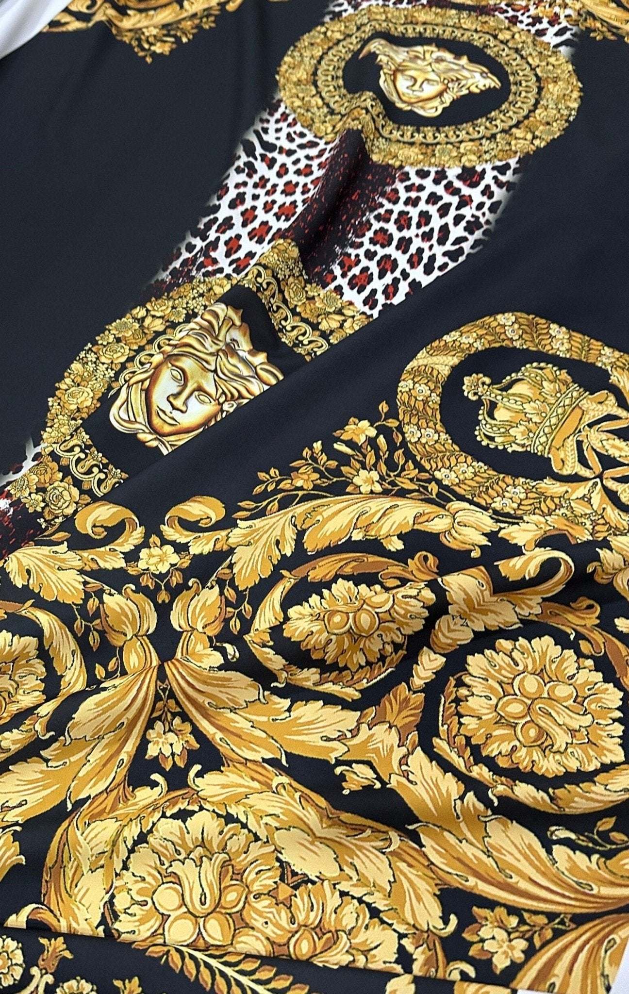 Black fabric with gold baroque patterns and leopard print accents design