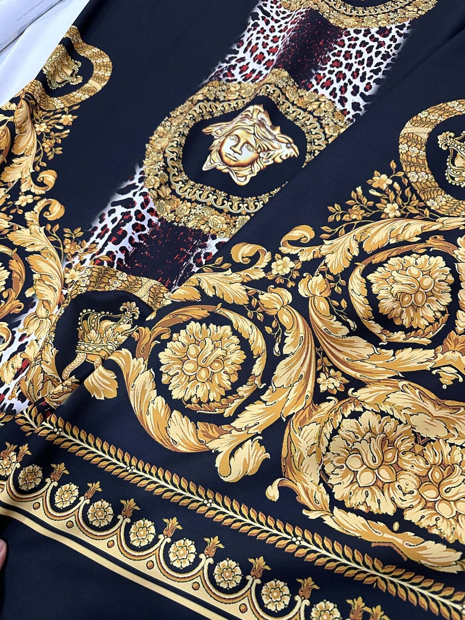 Baroque Leopard Fabric with luxurious gold baroque patterns and leopard print on black background