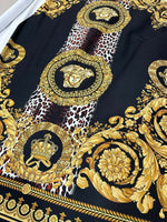 Baroque Leopard Fabric with luxurious gold baroque and leopard print design on black background