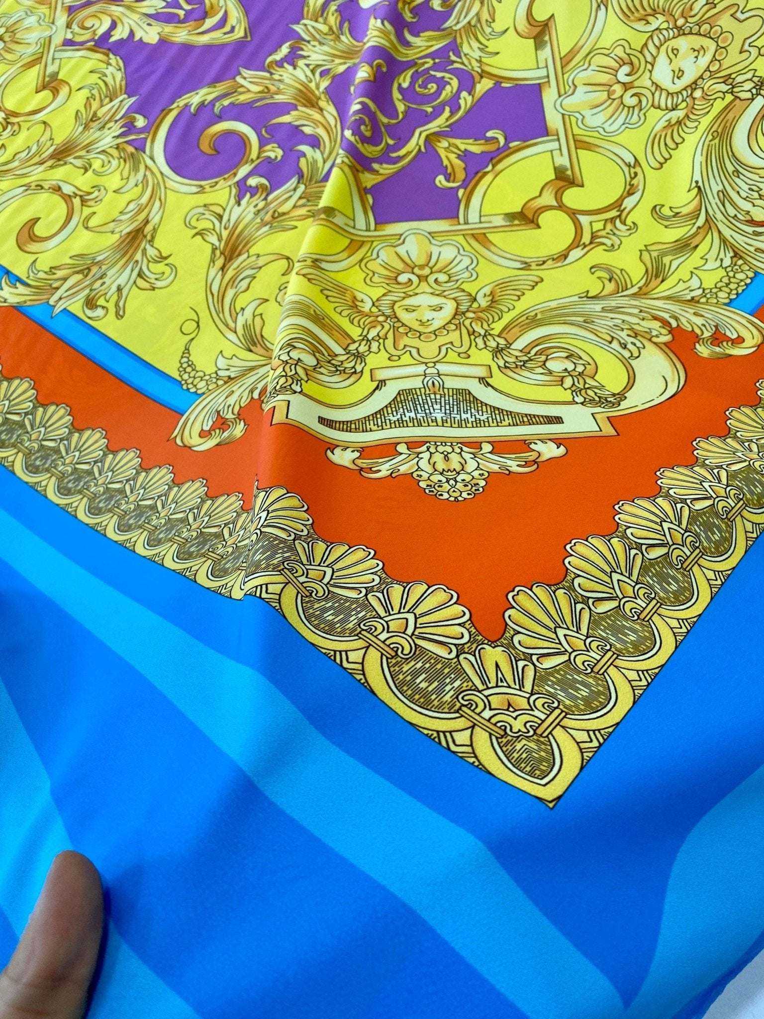 Baroque pattern silky crepe fabric in vibrant orange, blue, and yellow with ornate gold design, 150x100cm panel
