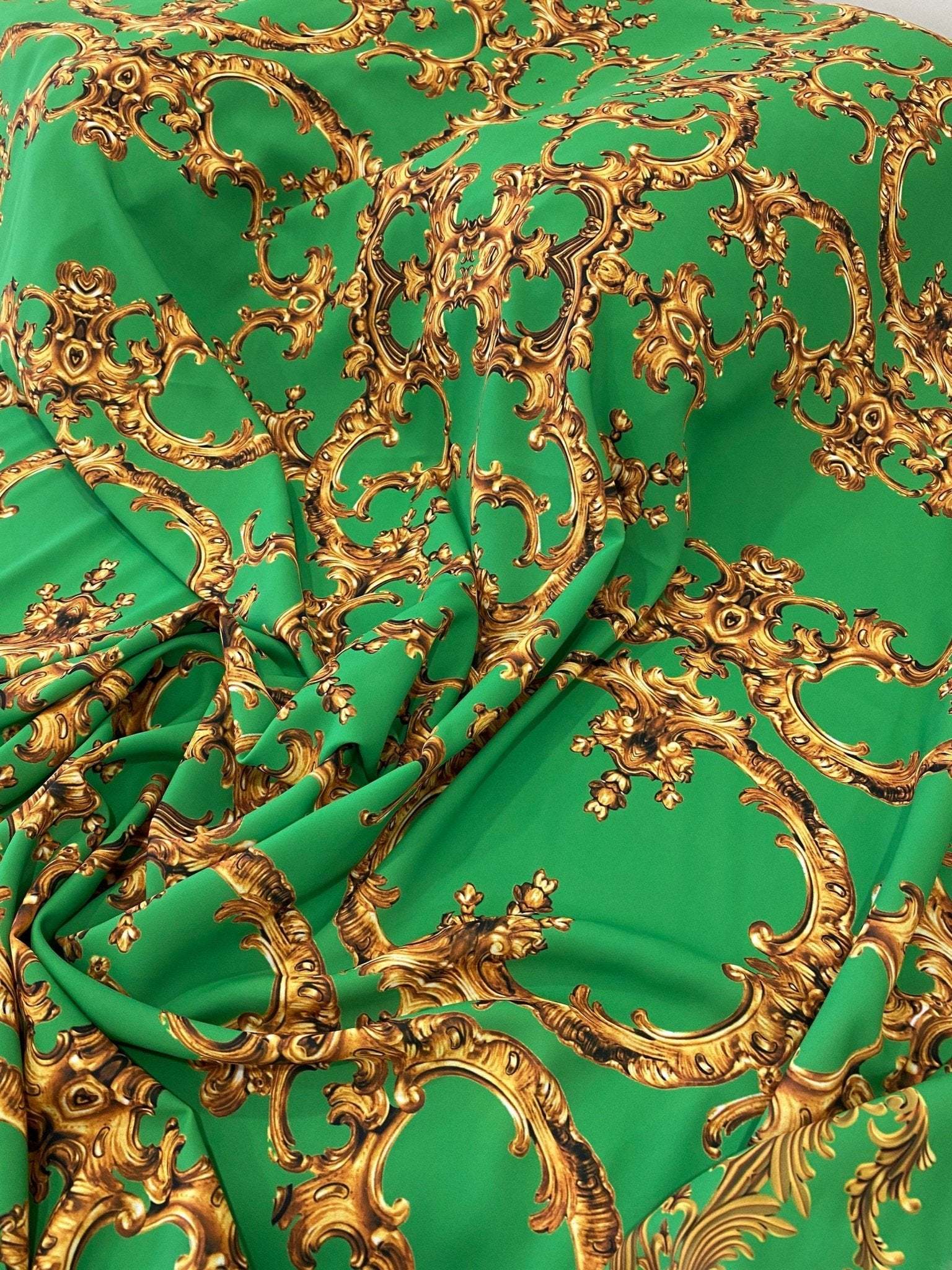 Baroque green and gold print fabric with intricate baroque design for upholstery and decor
