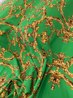 Baroque green gold print fabric with ornate baroque patterns on green upholstery material