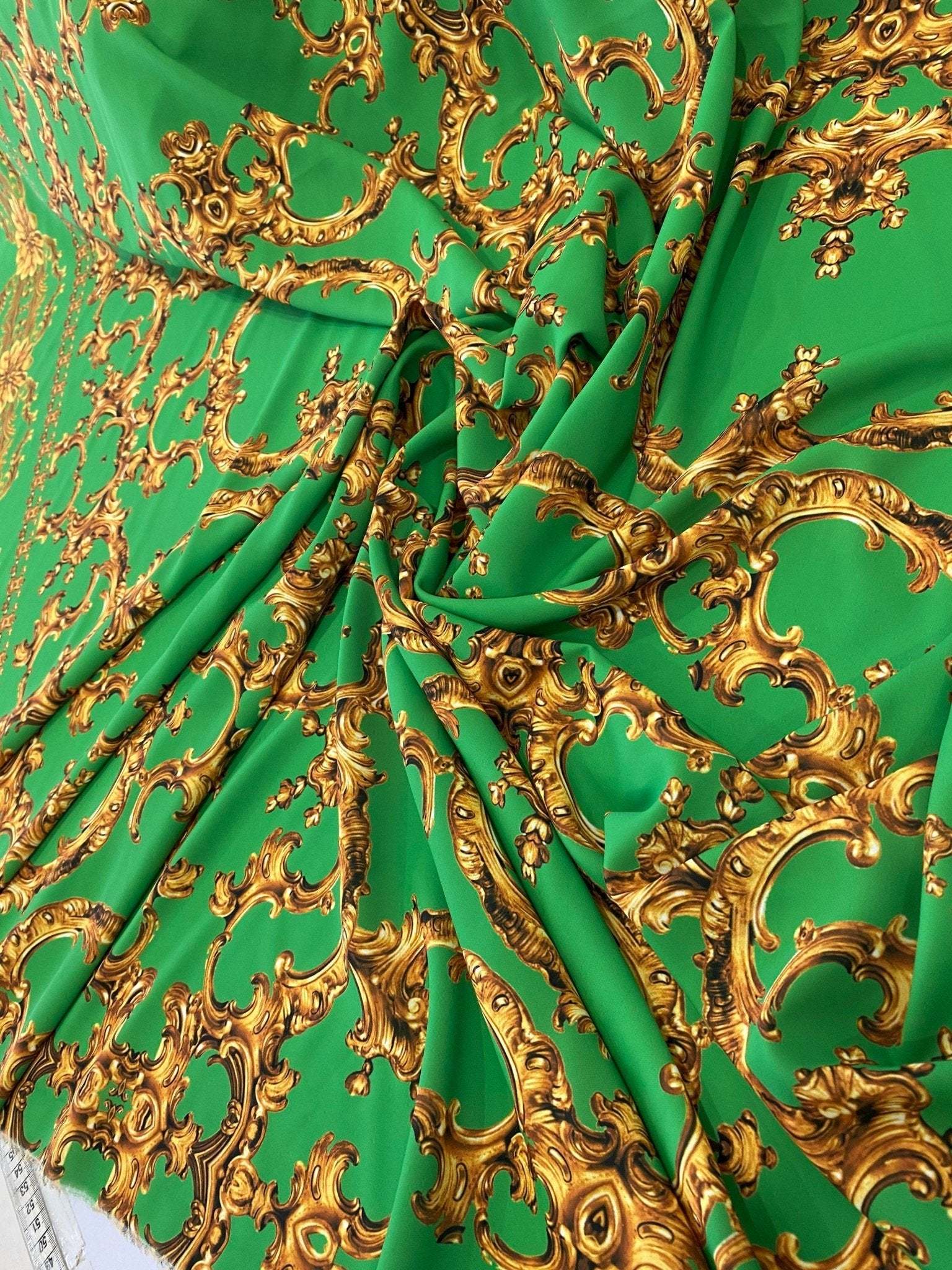 Baroque green fabric with intricate gold print upholstery material