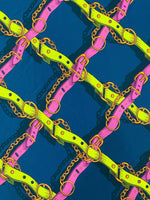 Pink and yellow chain pattern fabric with bright belts on a dark background