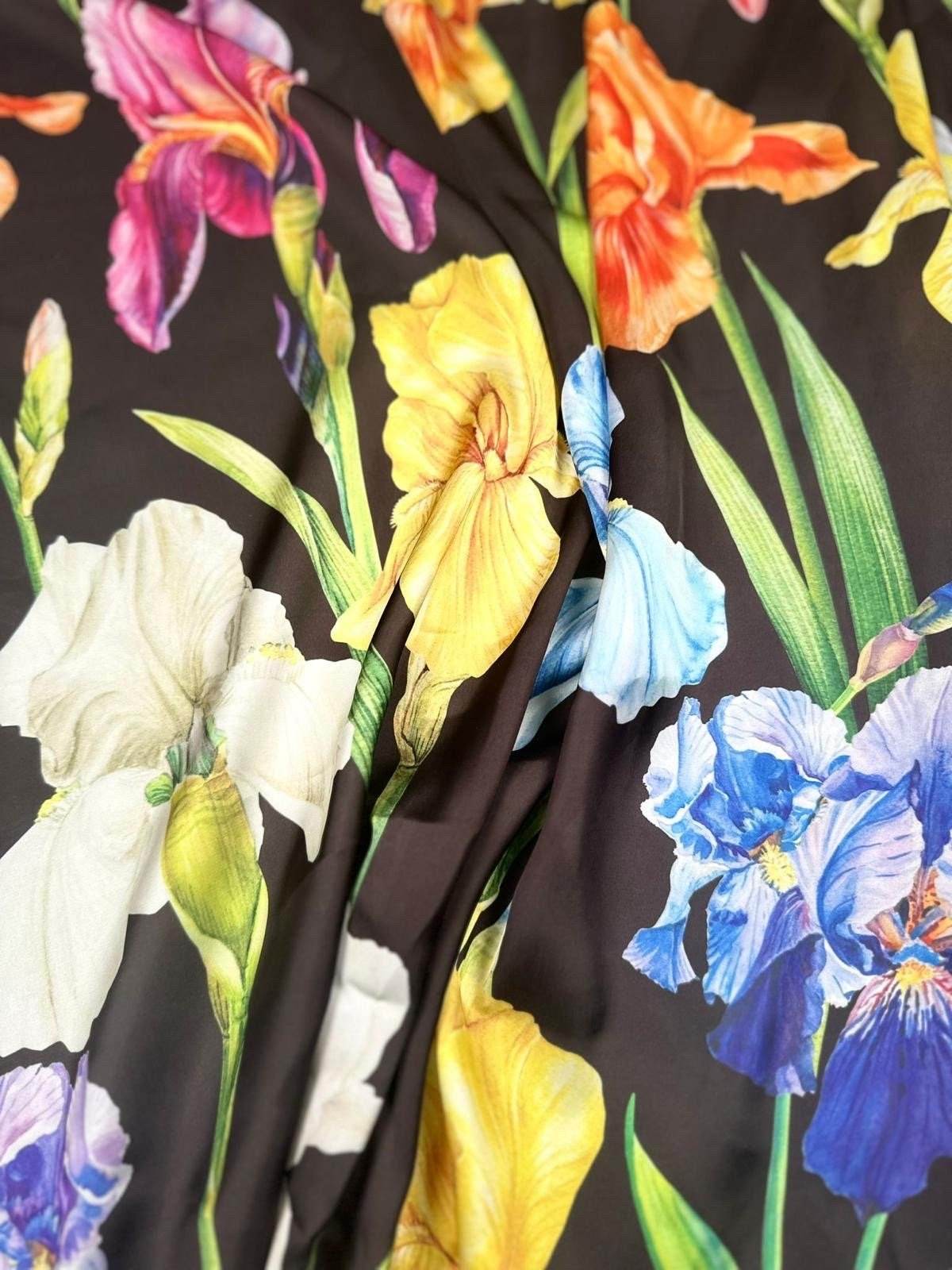 multicolor floral pattern fabric with large vibrant flowers on a black background