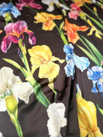 Multicolor floral pattern fabric with large vibrant flowers on black background