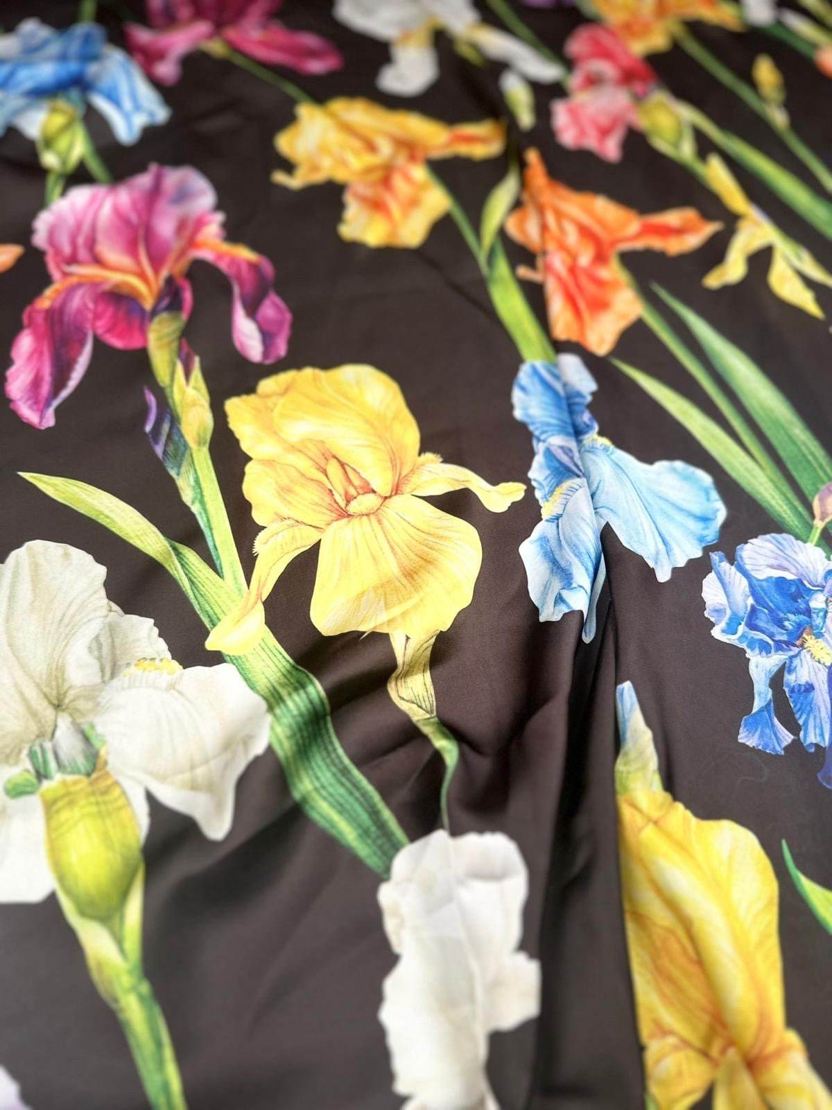Multicolor floral pattern fabric with large vibrant flowers on black background