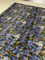 Black and blue tropical fabric with gold chain pattern on 150cm wide material