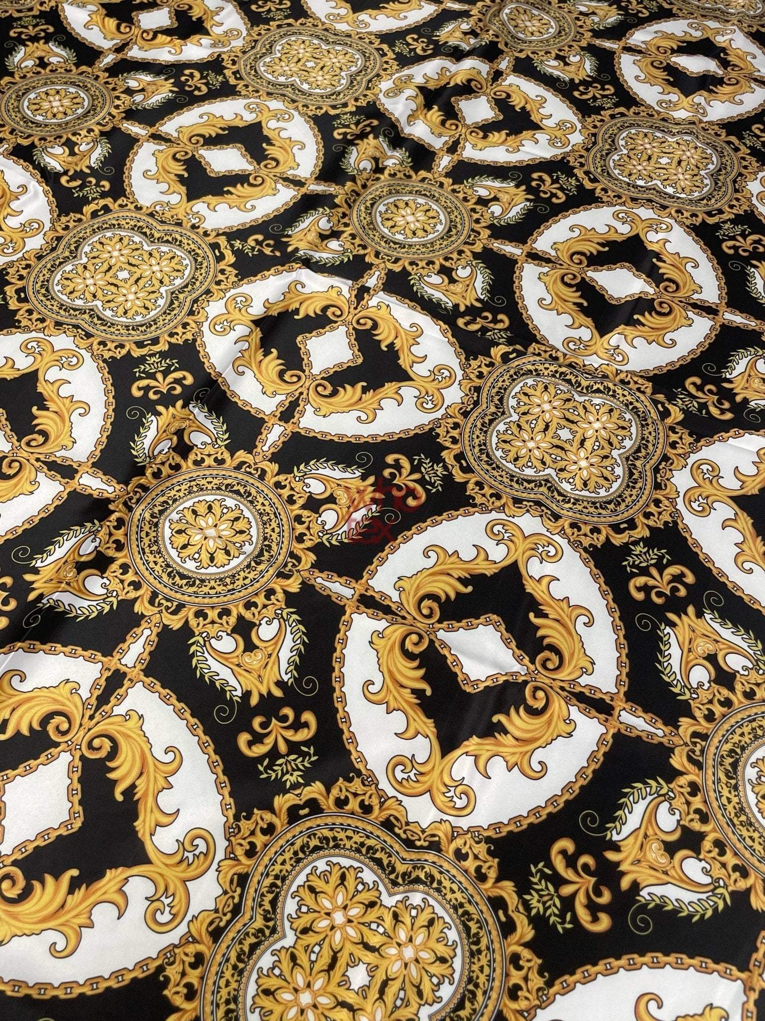 Black and gold medallion fabric with elegant Baroque design on black background