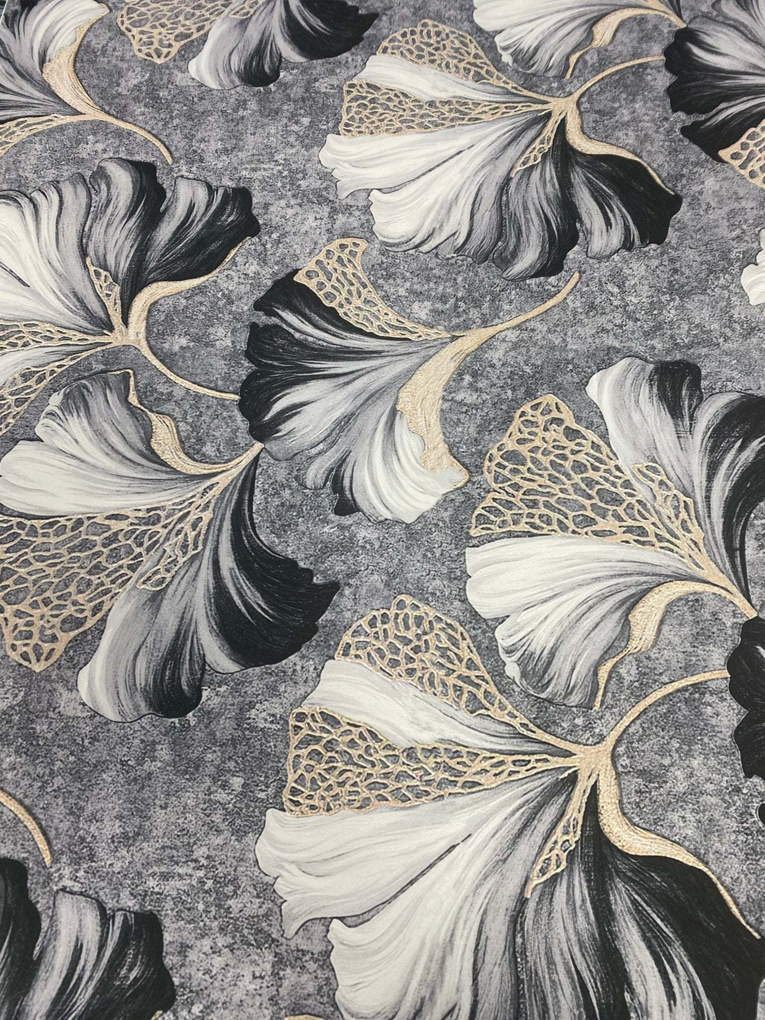 Black and white ginkgo leaf fabric with elegant gold vein botanical print on textured background