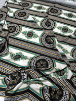 Greek Key Pattern Fabric with black, gold, and teal ornate circular and linear designs on white background