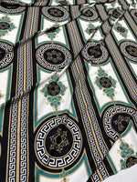 Greek Key Pattern Fabric with black, teal, and gold geometric and ornamental designs on white background, ideal for upholstery and drapery projects