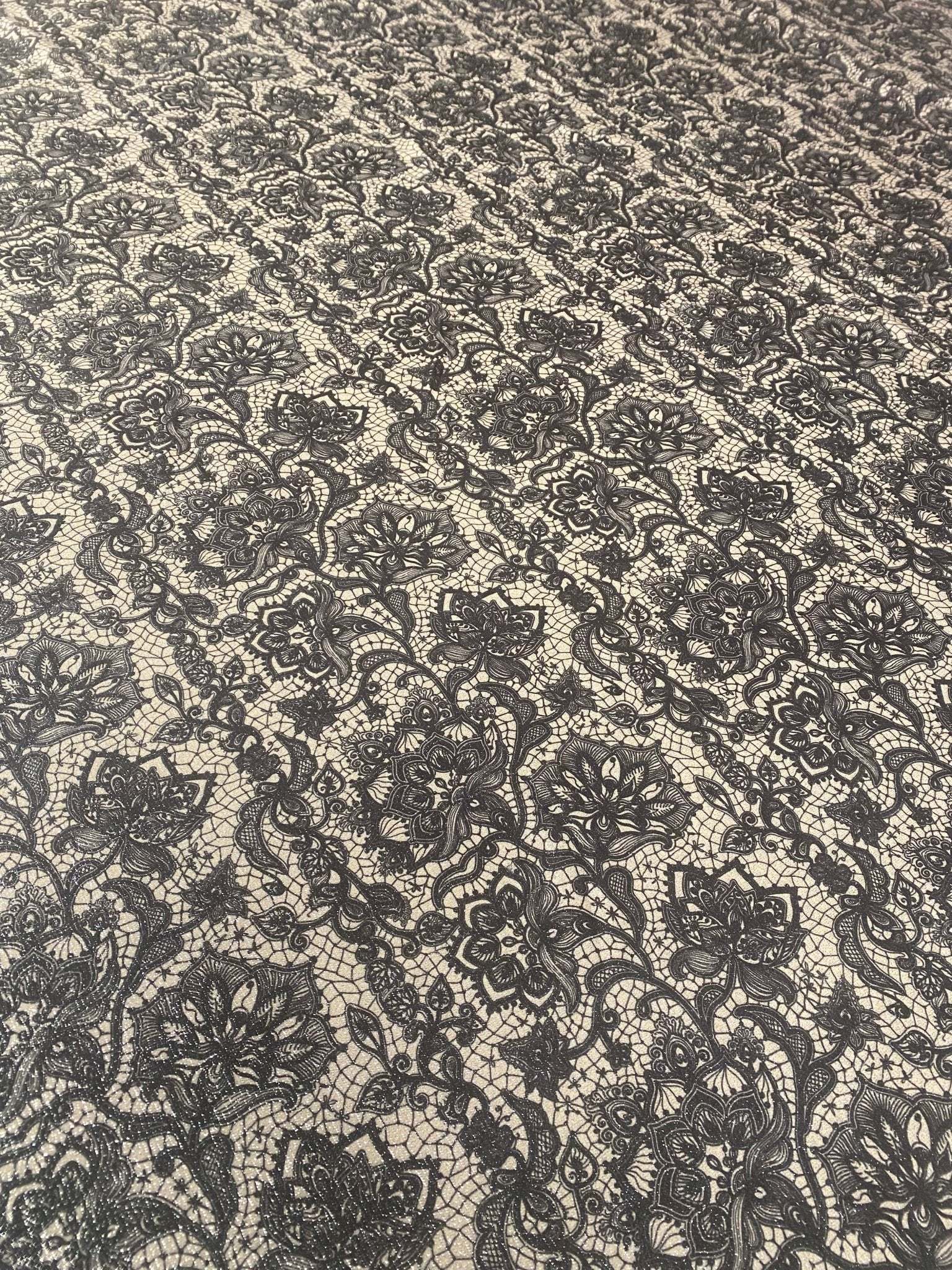 black floral lace fabric with intricate pattern on light background