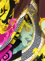 Black pink fabric with Greek key print and ornate baroque design in yellow and green