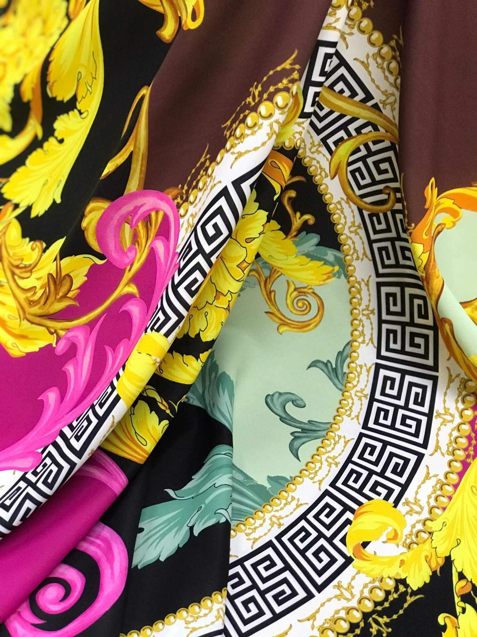 Black pink fabric with Greek key print and ornate baroque design in yellow and green