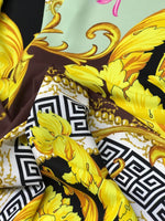 Black fabric with Greek key print and yellow ornamental design details