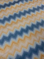 Blue and gold zigzag pattern Lurex fabric with 4-way stretch and glittery finish