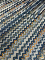 Gold Lurex striped glitter fabric with blue and orange zigzag pattern and 4-way stretch polyester blend