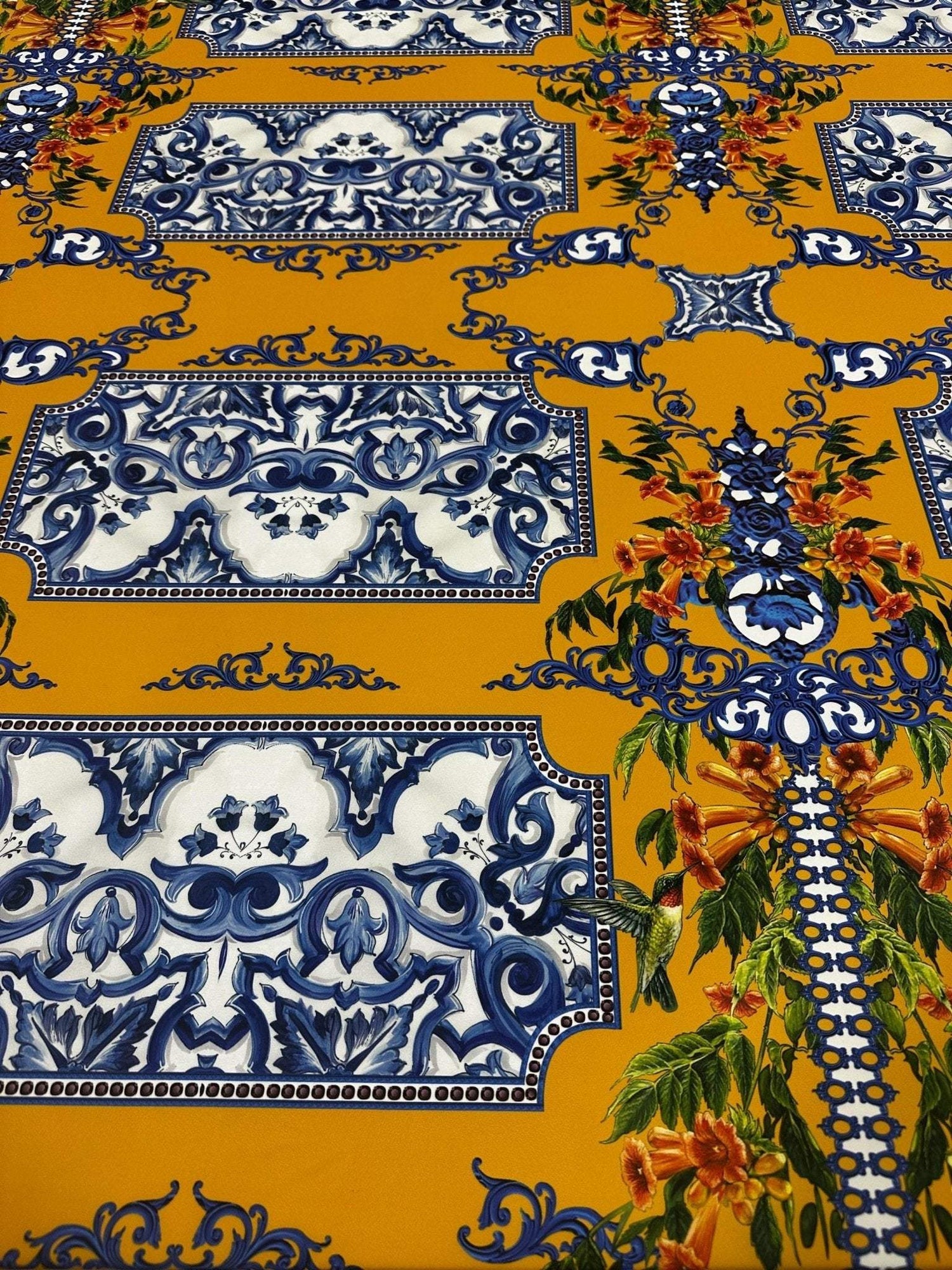 elegant mustard yellow baroque floral fabric with intricate blue and white patterns and detailed orange floral accents