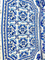 Blue Majolica pattern on silky crepe fabric with elegant blue and white design, ideal for stylish garments