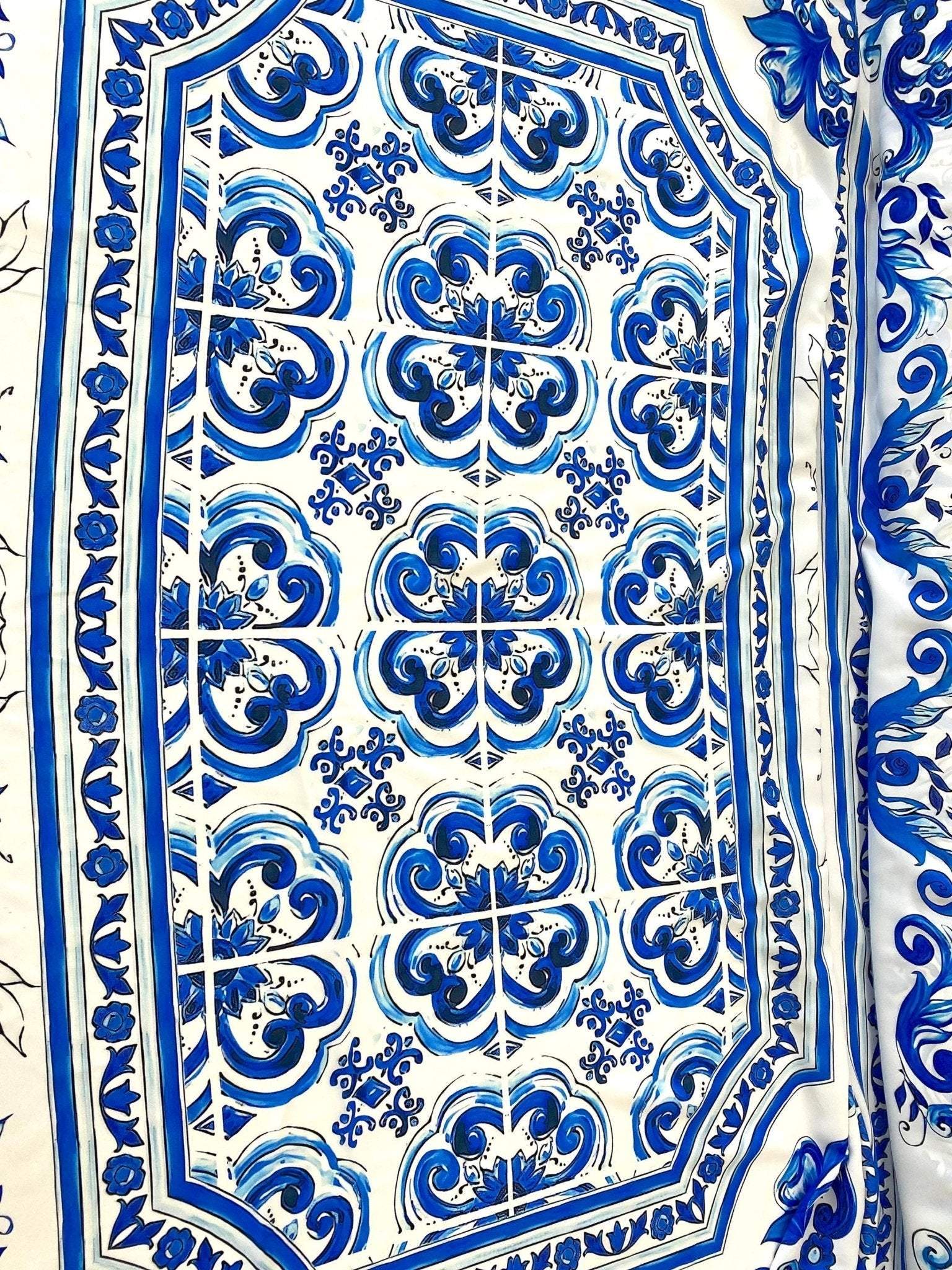 Blue Majolica pattern on silky crepe fabric with elegant blue and white design, ideal for stylish garments