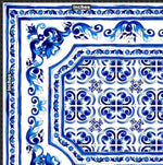 Blue Majolica silky crepe fabric with intricate blue floral and geometric patterns on white background, displayed with inch measurement scale