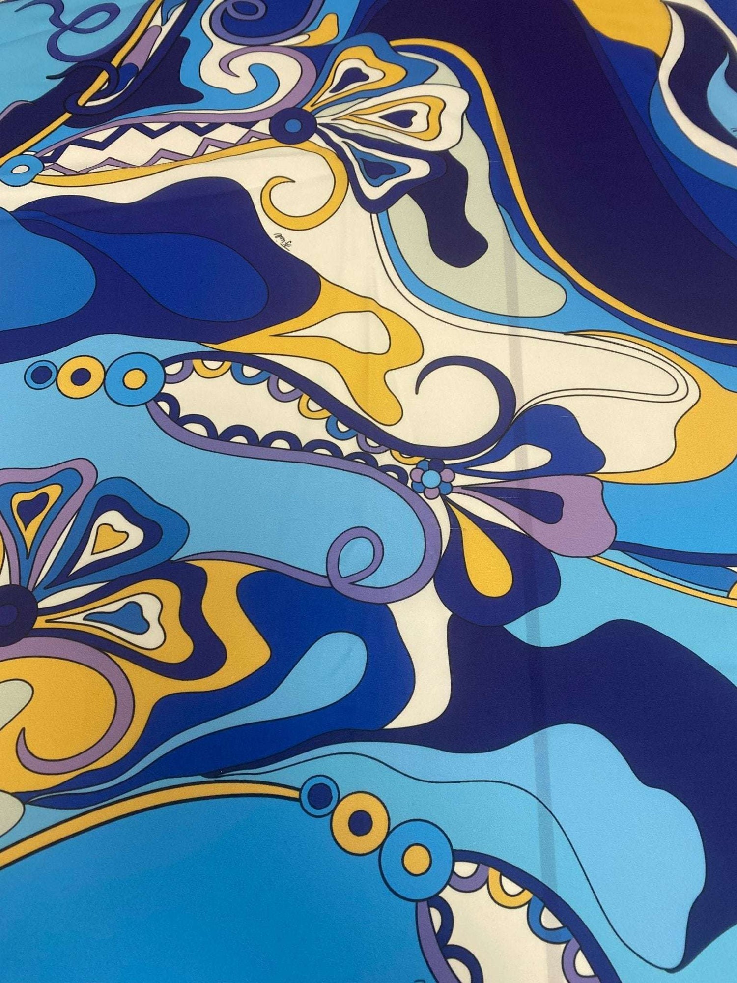 Blue yellow print crepe fabric with vibrant abstract design and smooth texture