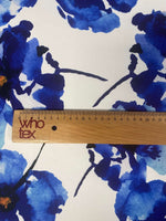Bold Blue Watercolor Floral Fabric with vibrant blue floral watercolor design and wooden ruler for scale