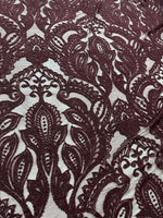 Bordeaux floral pattern lace fabric with intricate designs for fashion and decor projects