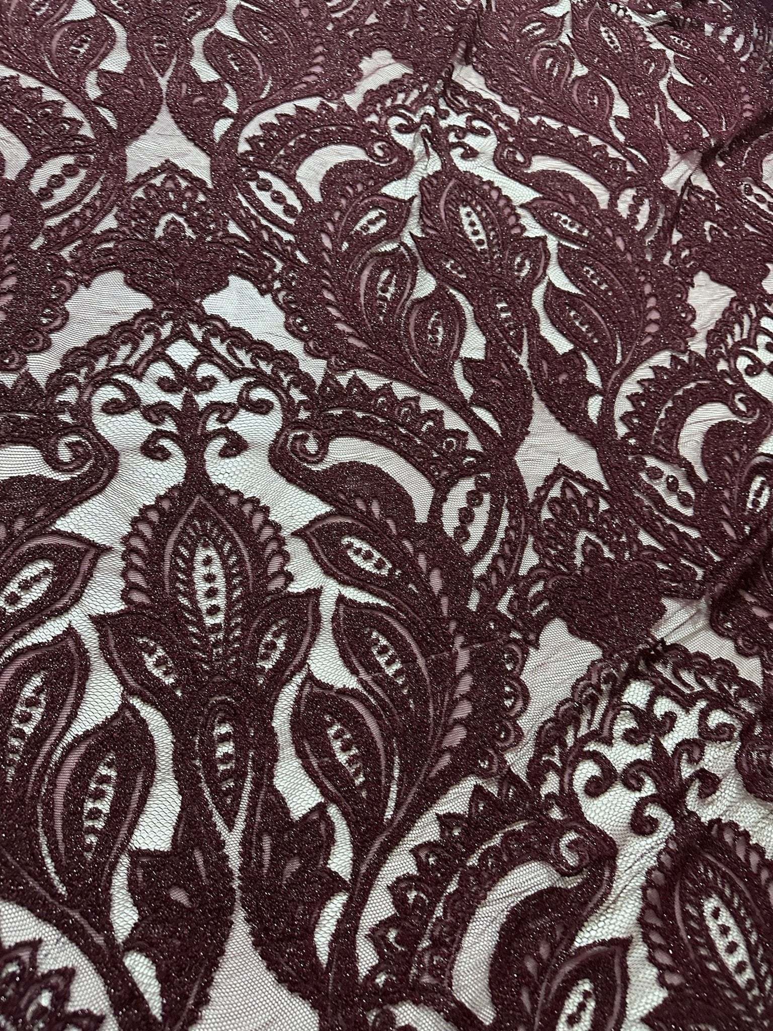 Bordeaux floral pattern lace fabric with intricate designs for fashion and decor projects