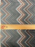 Brown and beige chevron zigzag pattern fabric with ruler for scale, 150cm wide textile for home decor and upholstery projects