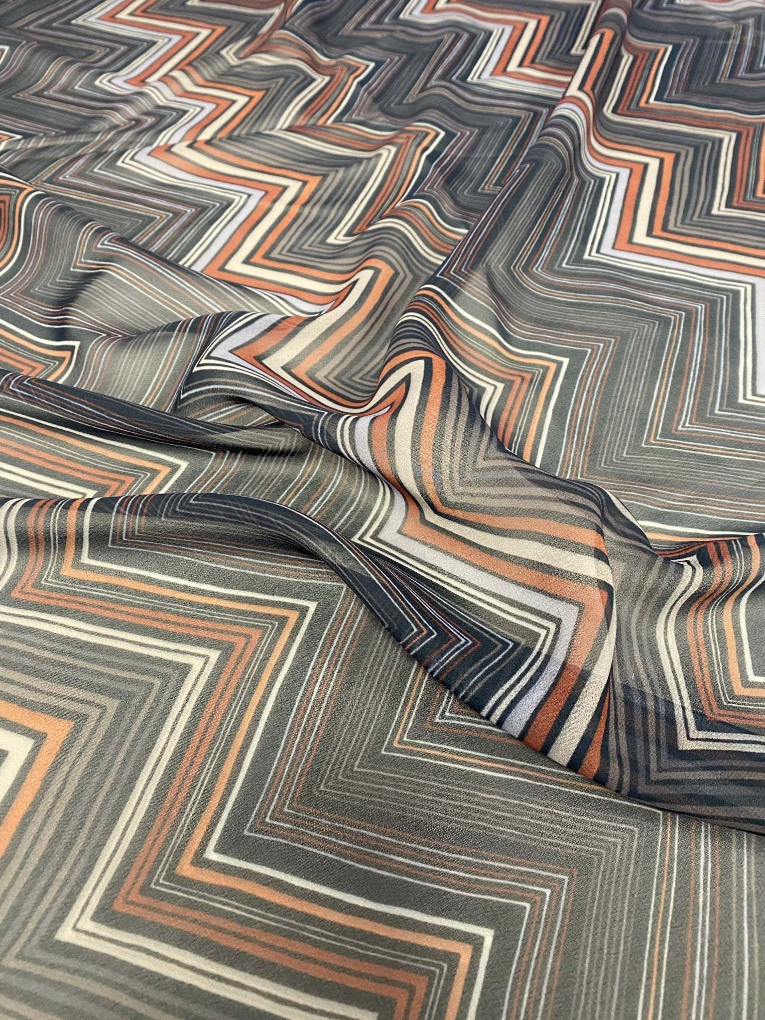 Brown and beige chevron zigzag pattern fabric with earthy tones and modern design for crafting and home decor