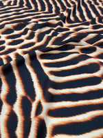 Brown and black animal print fabric with soft, durable texture and 150cm width for sewing projects