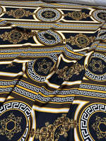 Brown silky crepe fabric with Greek key pattern and elegant gold and black design