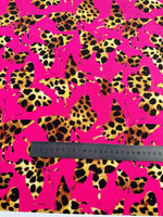 Hot pink fabric with leopard-print butterfly pattern and measuring ruler