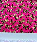 Hot pink fabric with leopard print butterfly pattern for sewing and crafting projects