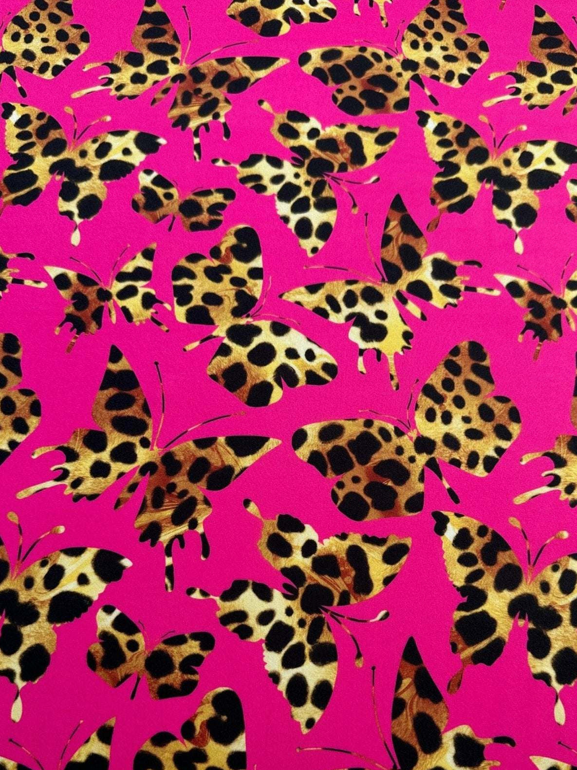 Hot pink fabric with leopard print butterfly pattern