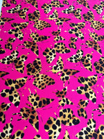 Hot pink fabric with leopard print butterfly pattern for sewing and crafting projects