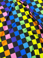 Rainbow Checkers Print Fabric featuring vibrant multicolor checkerboard pattern on smooth wide fabric ideal for sewing projects