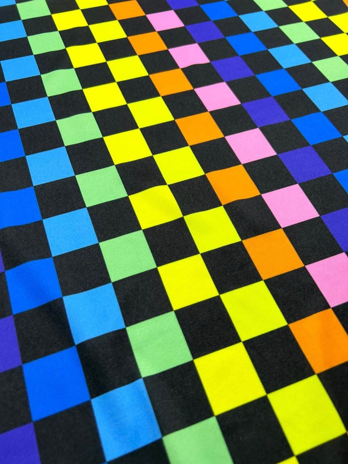 Rainbow checkers print fabric with vibrant multicolor squares on black background, perfect for sewing projects and crafts