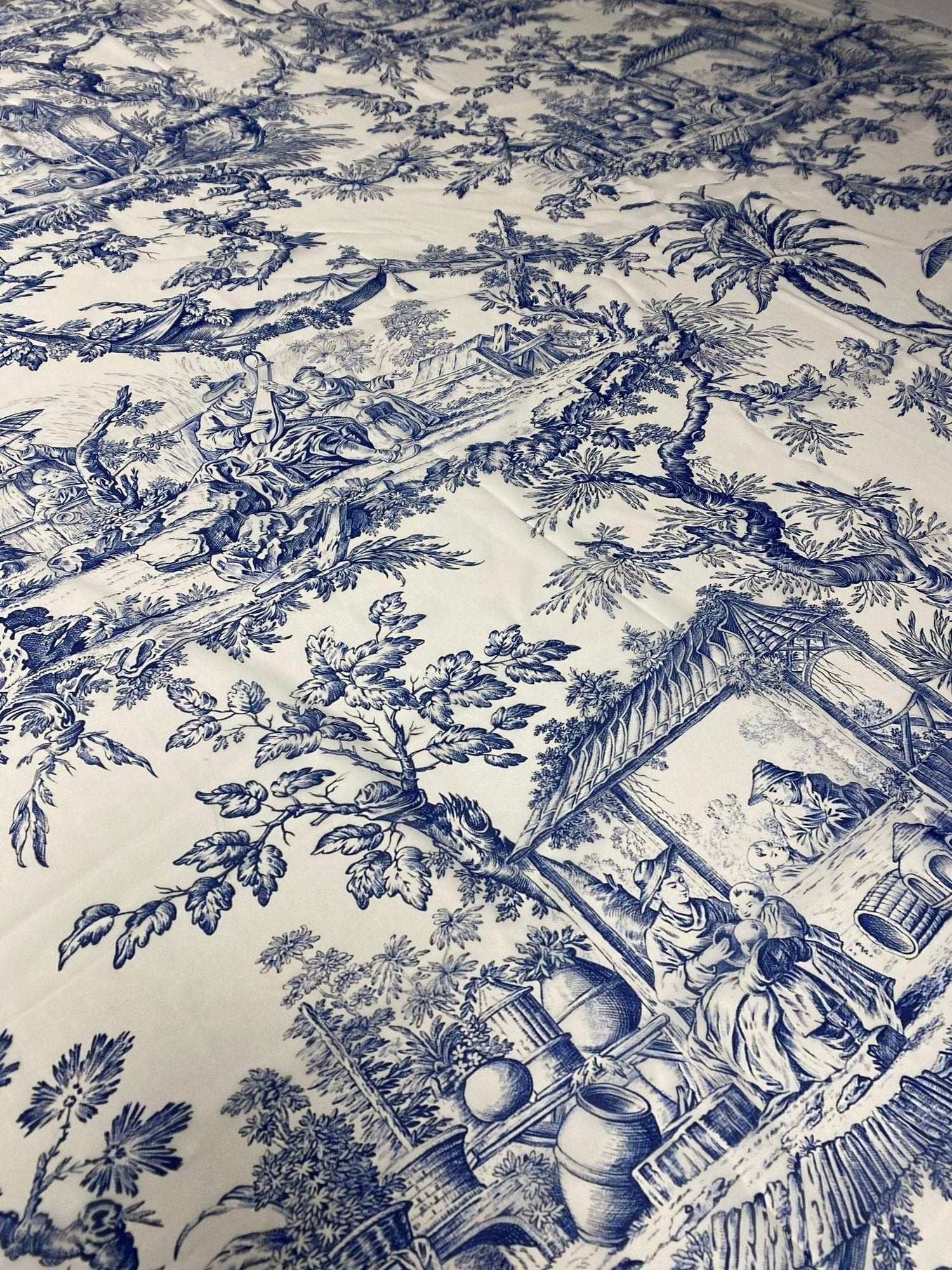 Classic Blue Toile de Jouy Print Fabric with detailed pastoral scenes in elegant blue on white background, ideal for upholstery and curtains