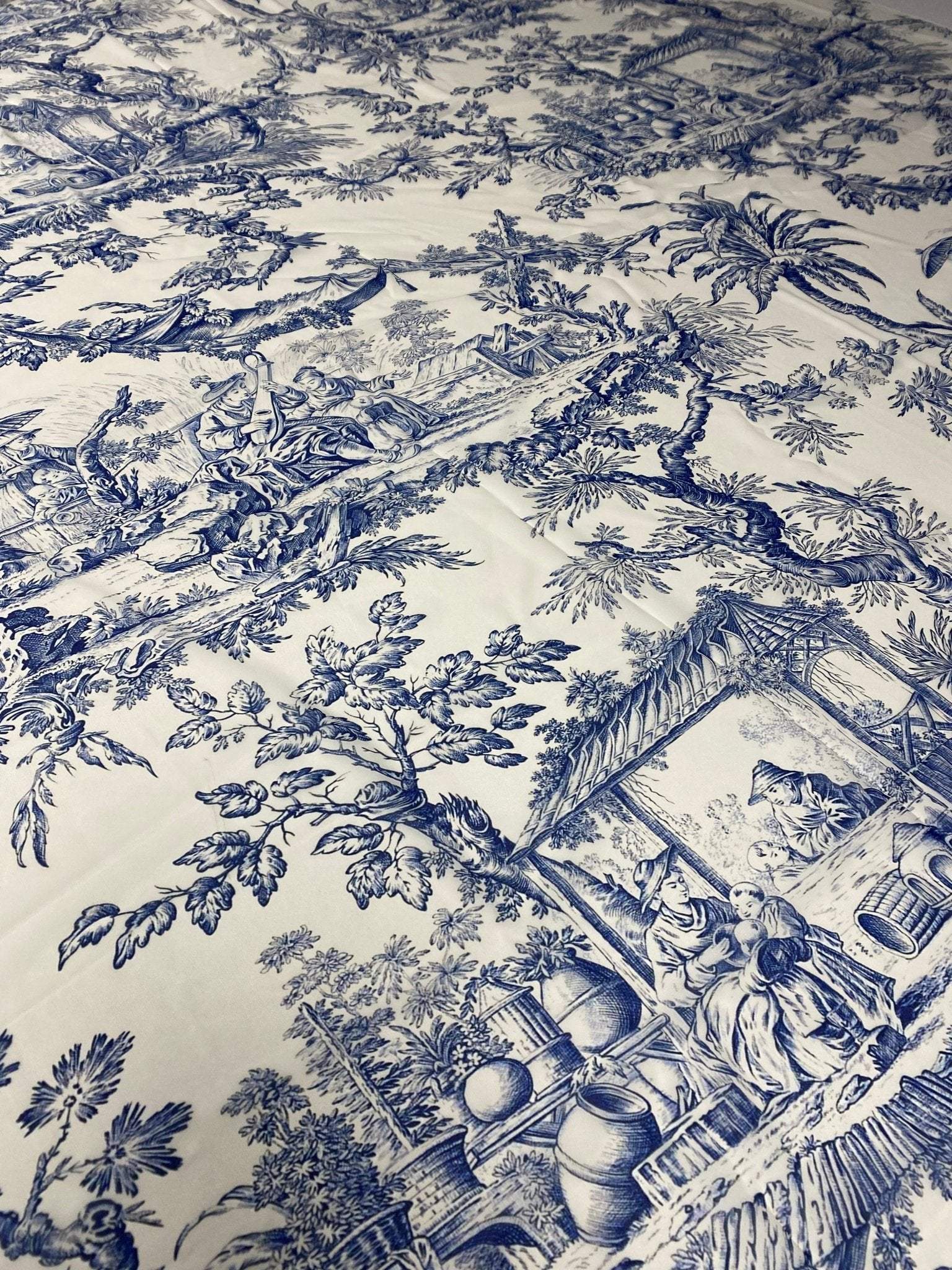 Classic Blue Toile de Jouy Print Fabric with detailed pastoral scenes in elegant blue on white background, ideal for upholstery and curtains