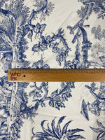Classic blue Toile de Jouy print fabric with detailed classic pastoral scenes and foliage on white background, ruler showing scale