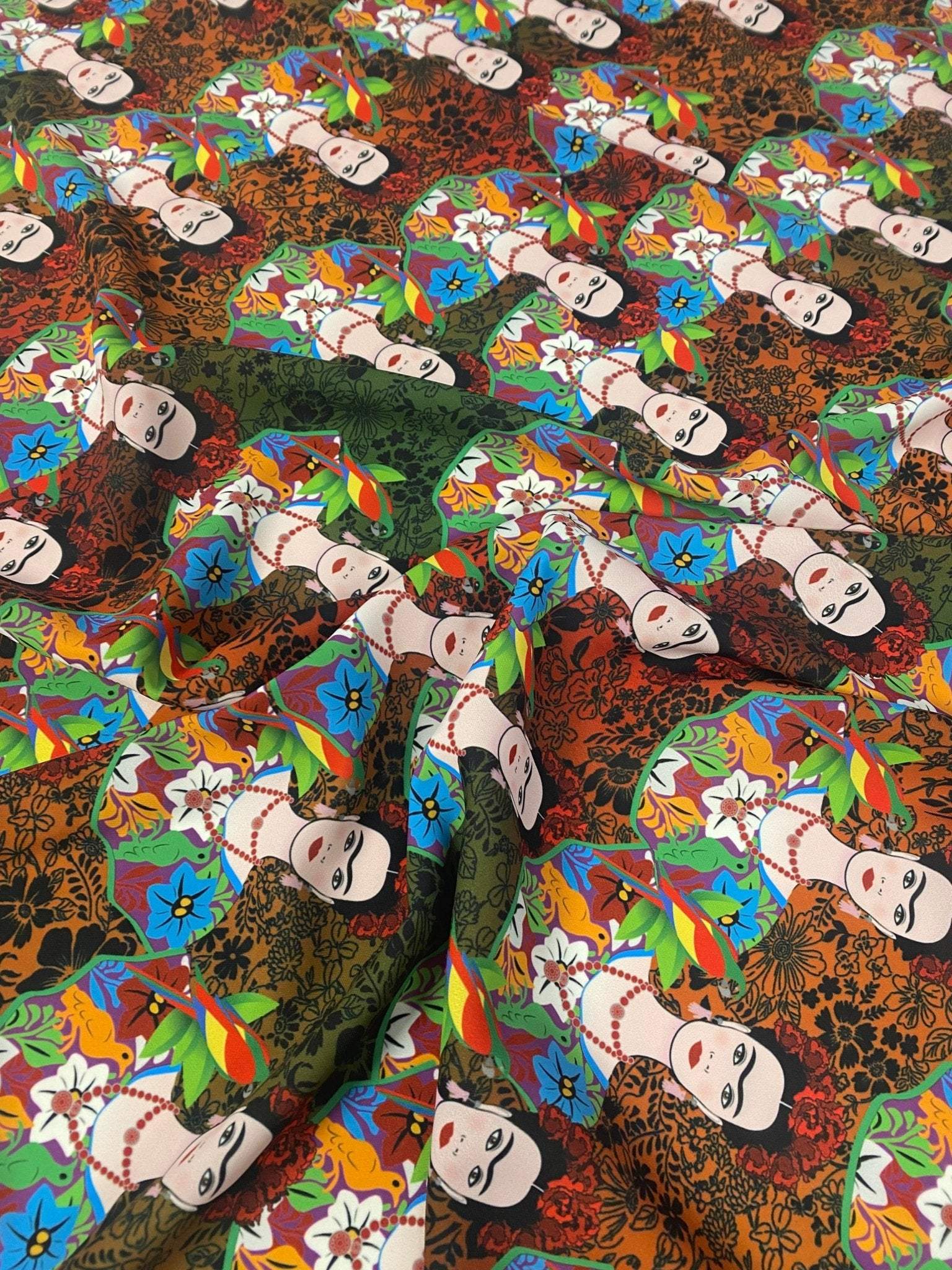 Colorful Frida Kahlo inspired floral print fabric with vibrant flowers and portrait motifs on fabric with 150cm width