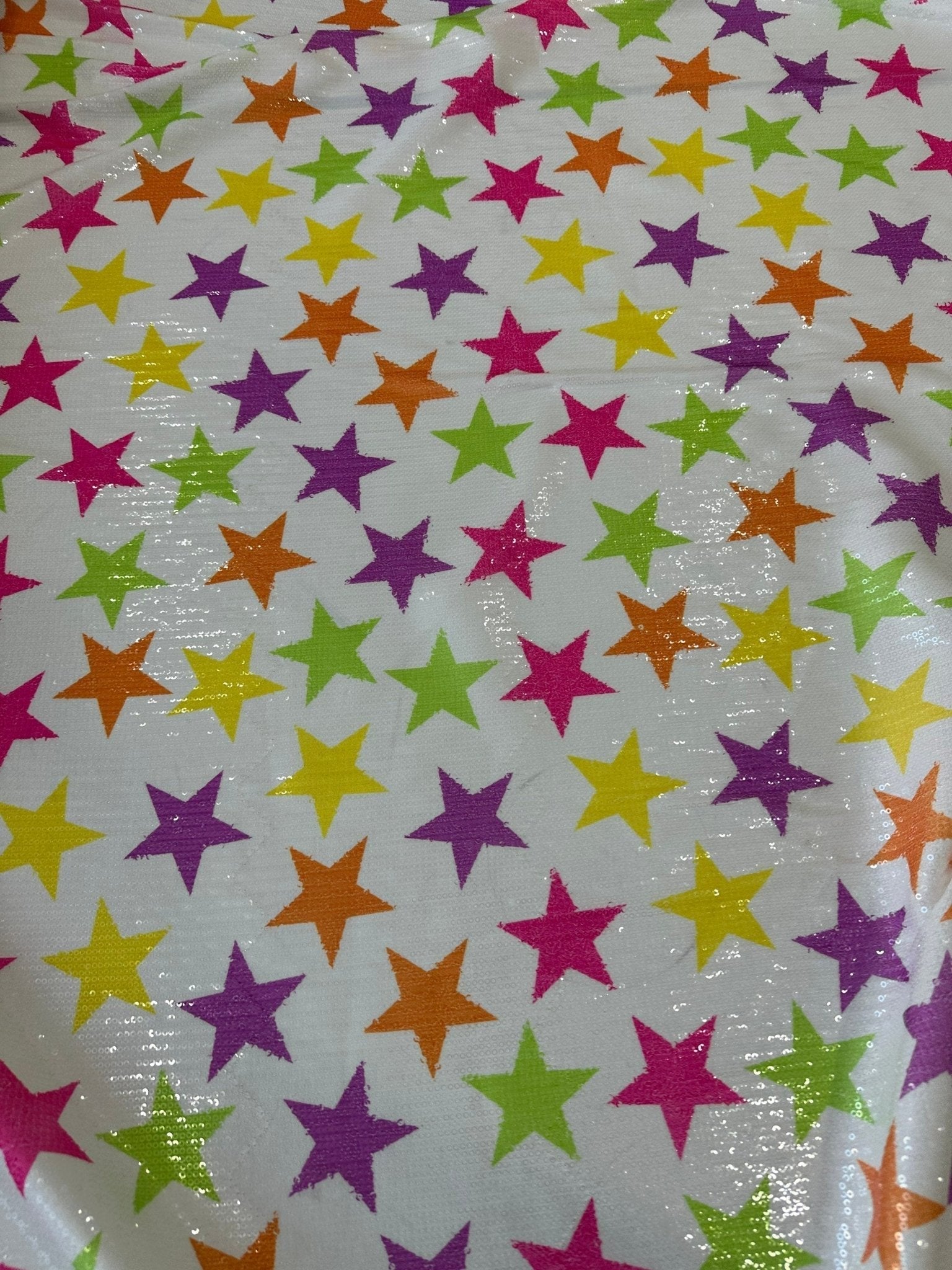 Colorful stars sequin fabric with 2-way stretch, ideal for stylish evening wear and garments